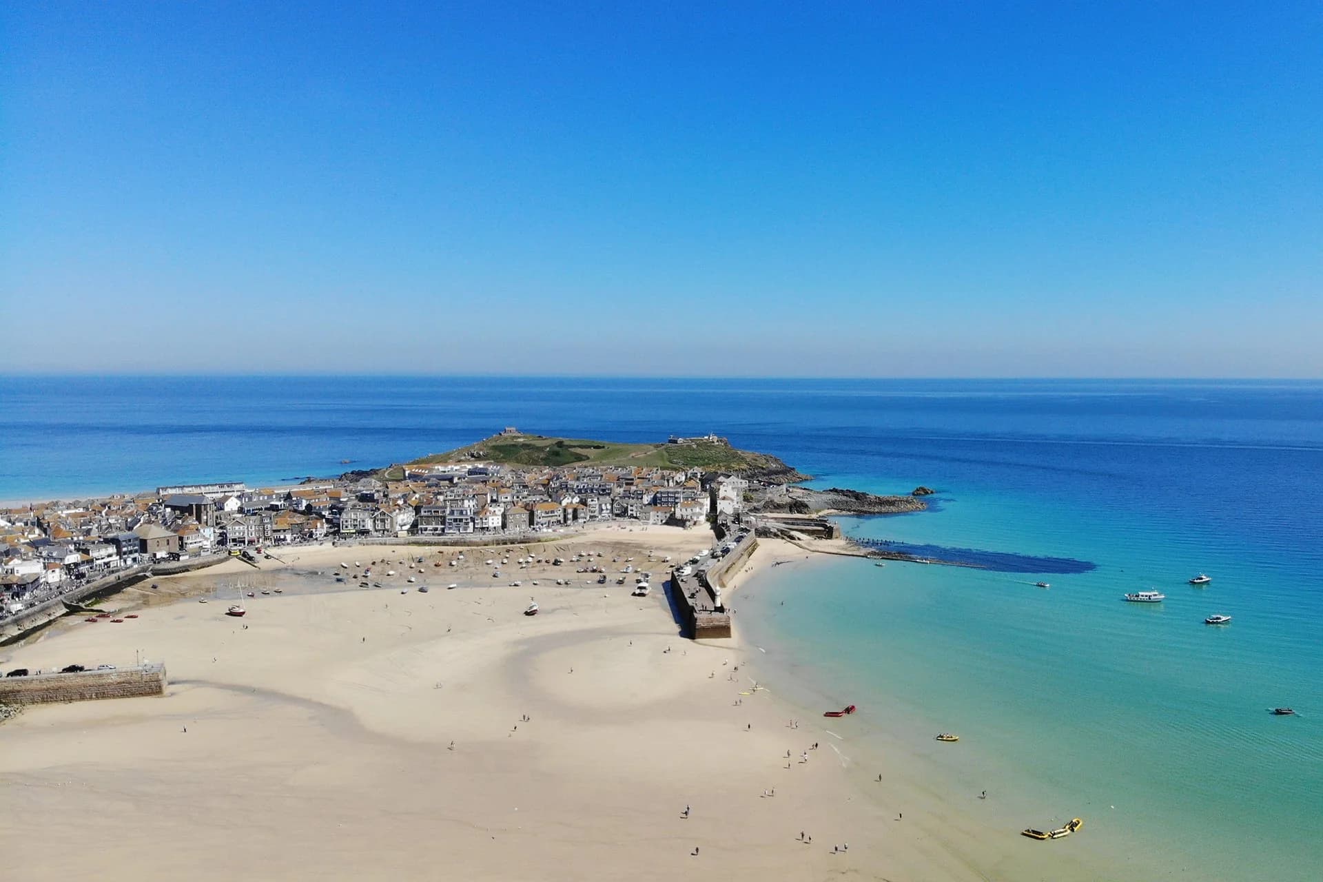 Aerial view of a turquoise coastal harbour.